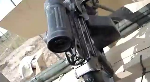 American soldier throws candy to kids in Iraq